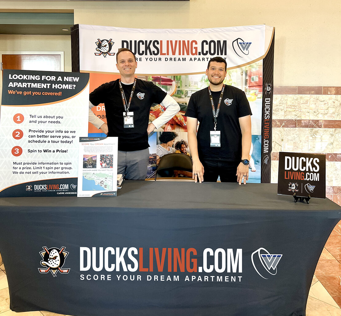 a couple of Ducksliving team members at a Ducksliving booth
