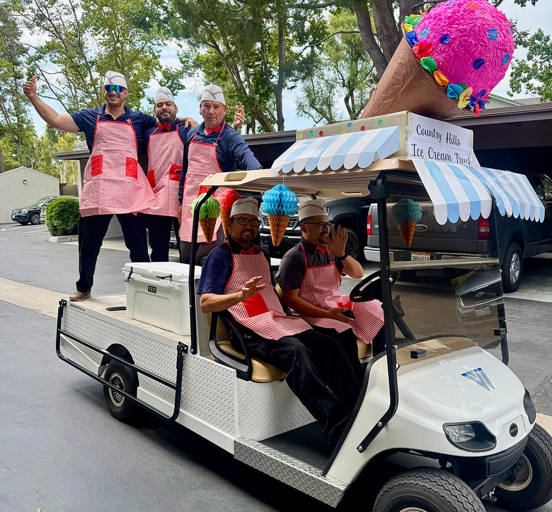 Ducksliving team members in a golf cart serving ice cream