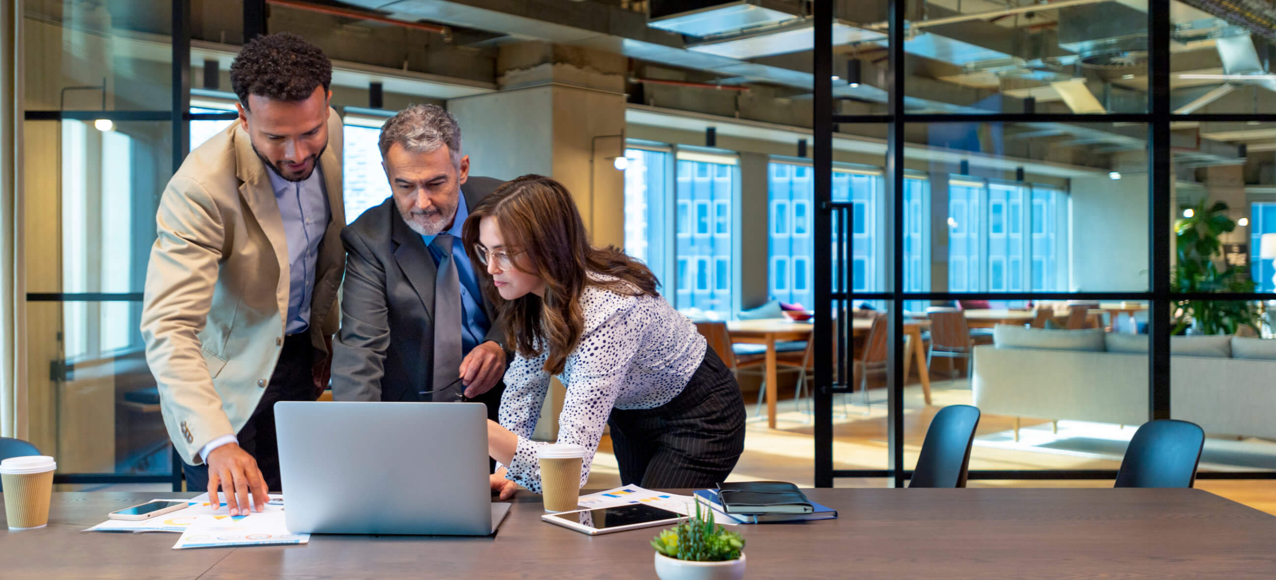 business colleagues looking at a laptop screen